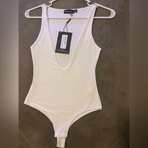 PrettyLittleThing Cream Sleeveless Fitted Bodysuit